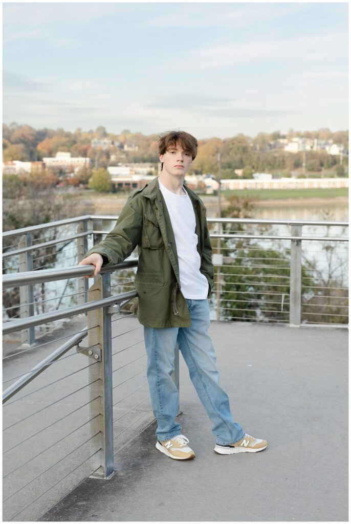 boy leaning against the steel railing on the walkway near the Hunter Museum in Chattanooga