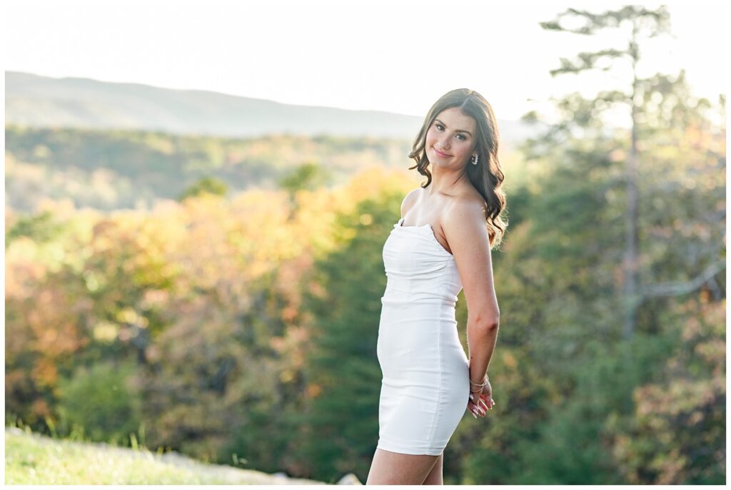 senior girl posing with her hands behind her waist at Chattanooga portrait session