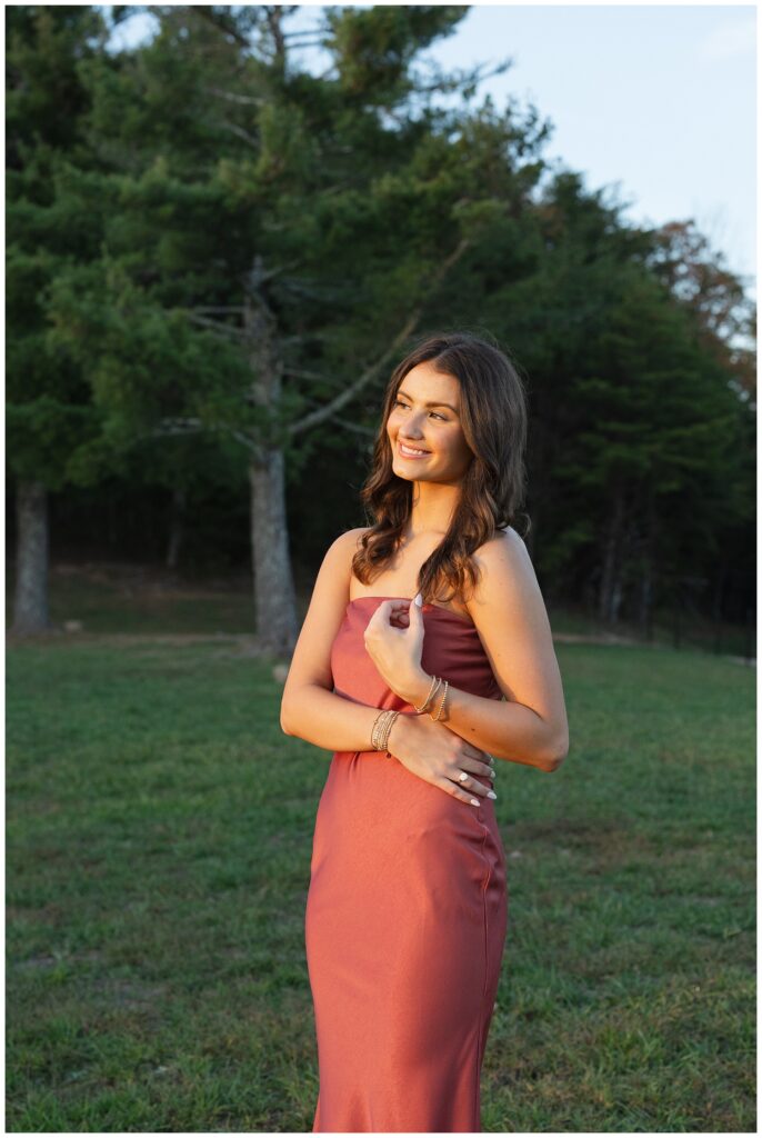 senior girl facing the sun and holding her hair at Chattanooga portrait session