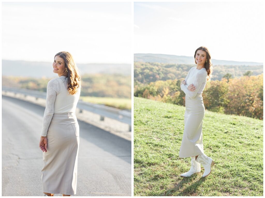 senior girl posing with her arms crossed with the mountains in the background 