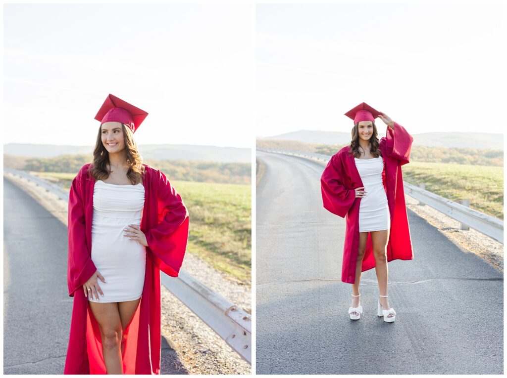 senior wearing a white dress and red cap and gown and posing for Chattanooga portrait session