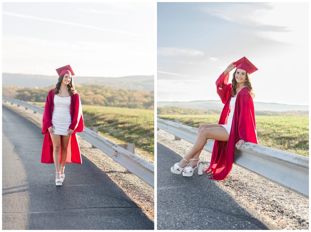 senior girl sitting on a guardrail wearing her red cap and gown in Chattanooga