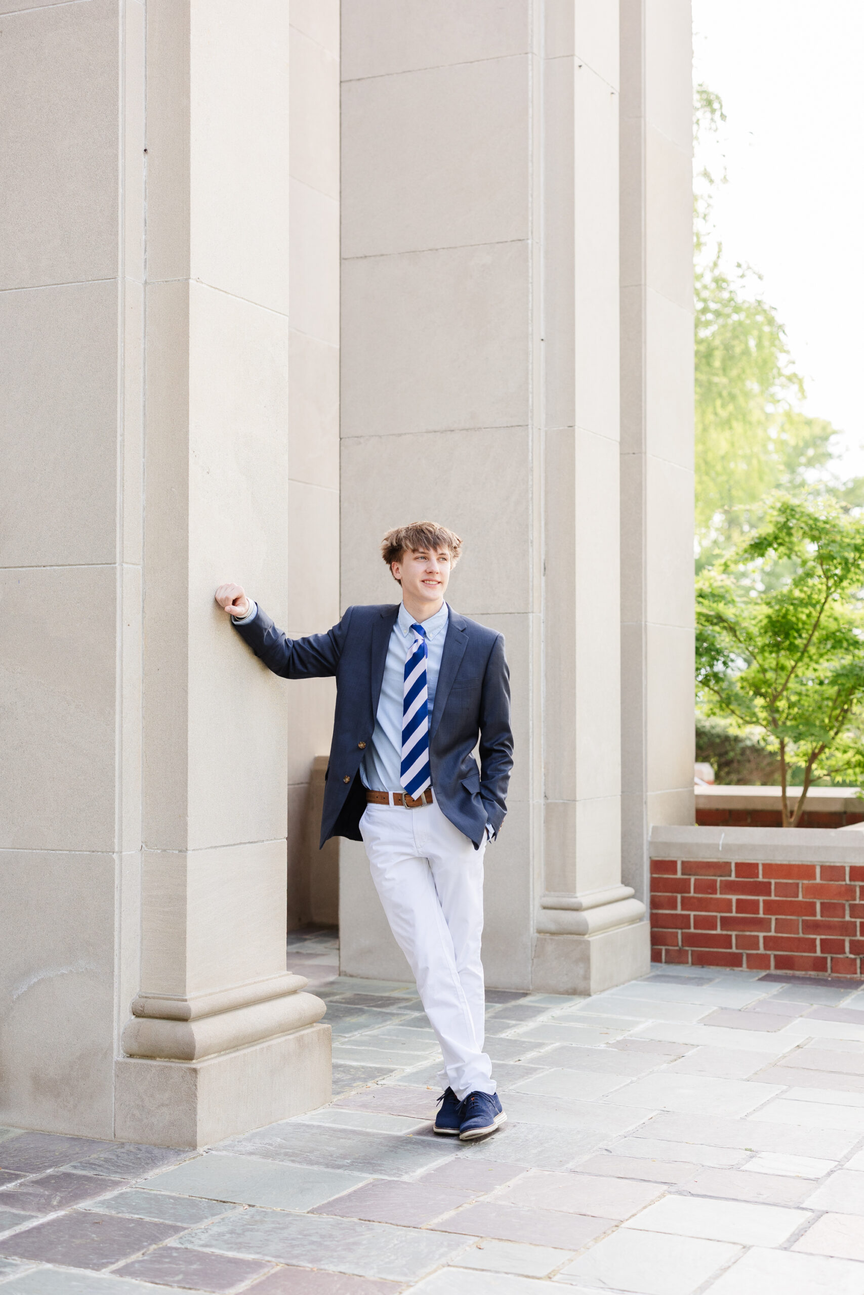 Chattanooga high school senior leaning against a column at session