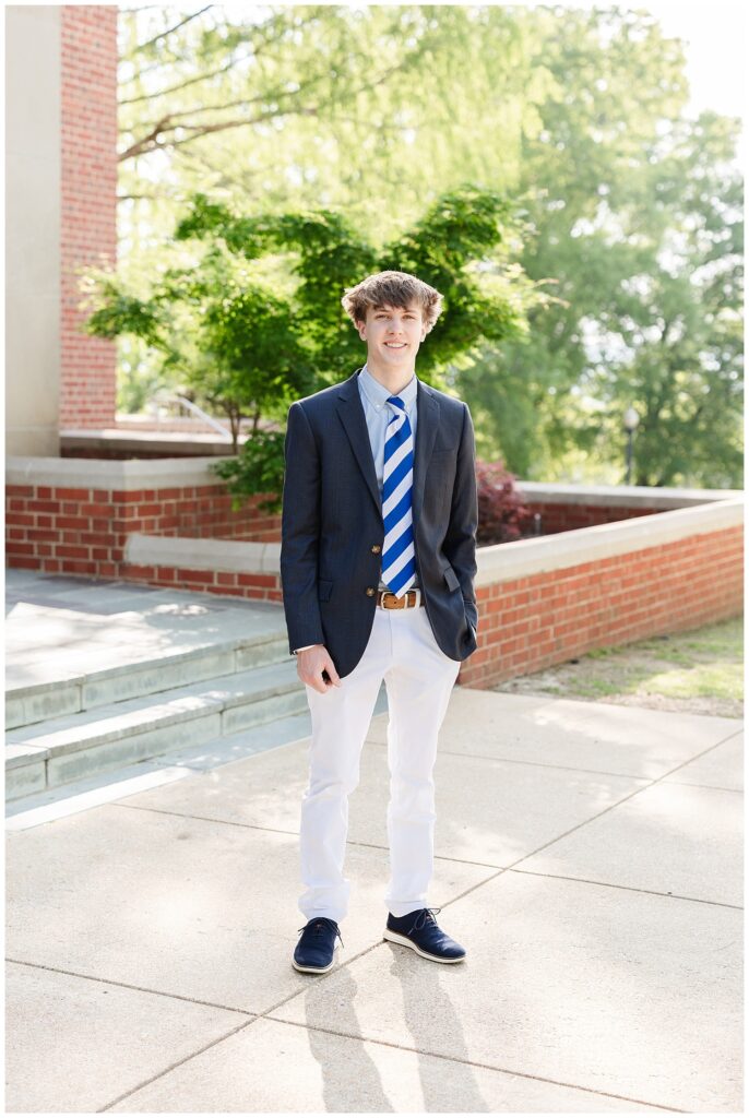 senior guy posing at the McCallie School for portraits with Chattanooga photographer
