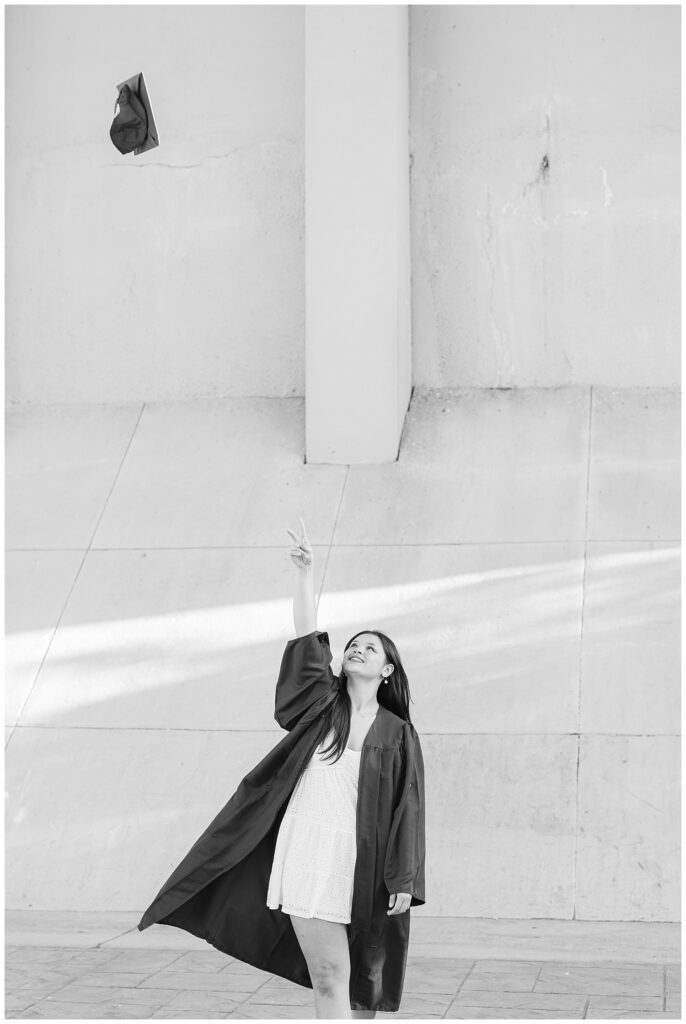 Chattanooga senior girl throwing her cap into the air at portrait session