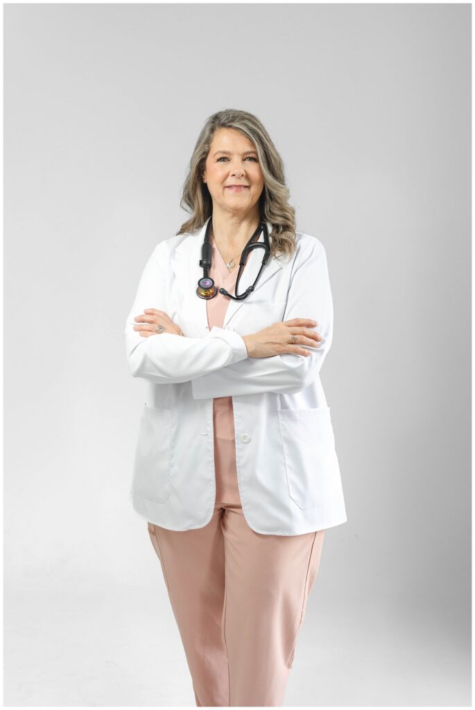 nurse wearing a white coat and wearing stethoscope and posing for Chattanooga branding session