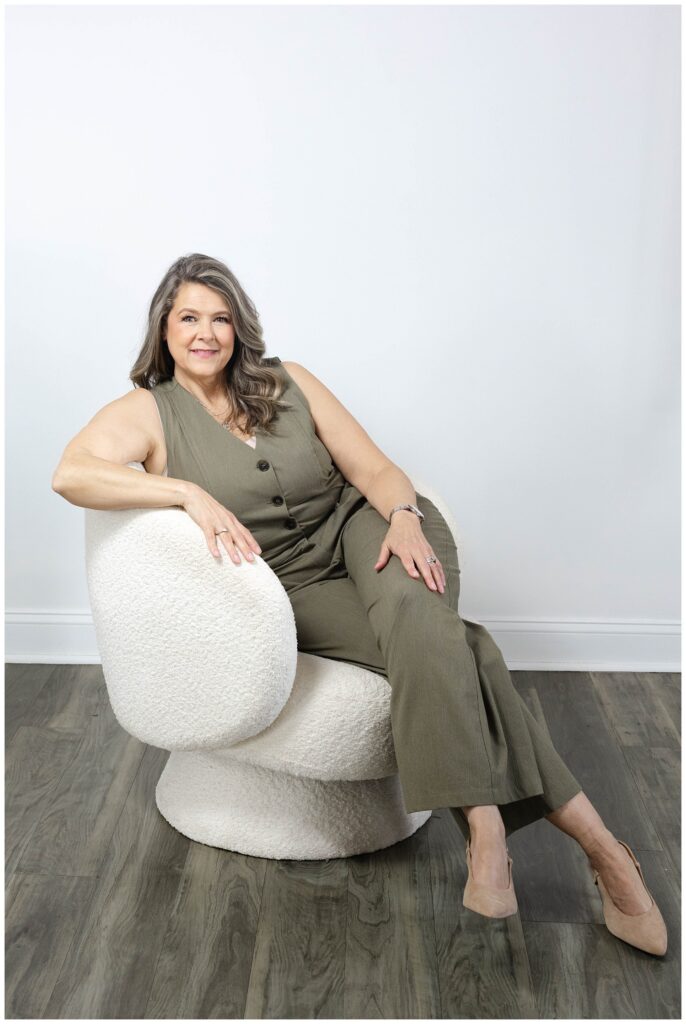 branding session with nurse practitioner posing in a white chair at Chattanooga photographer
