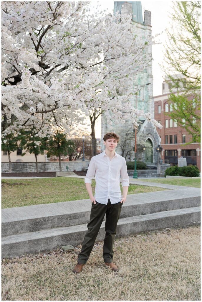 senior session downtown at Phillips Park in Chattanooga with white trees in the background