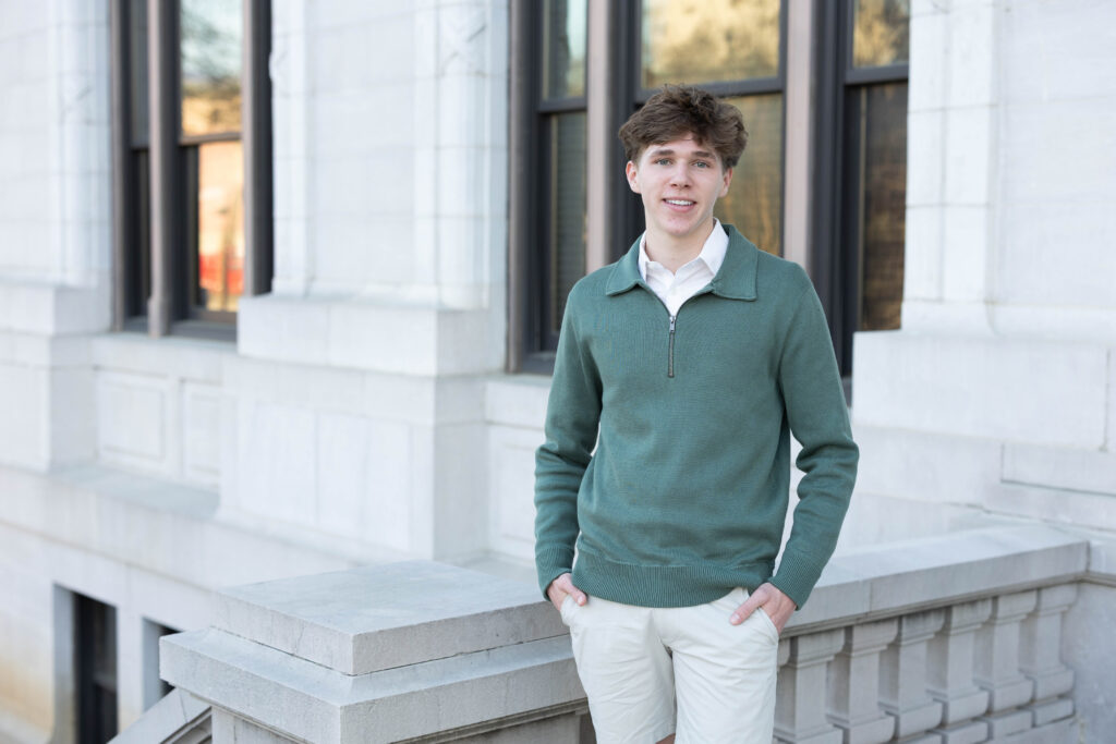 high school senior posing on the top of the stairs at the Chattanooga courthouse