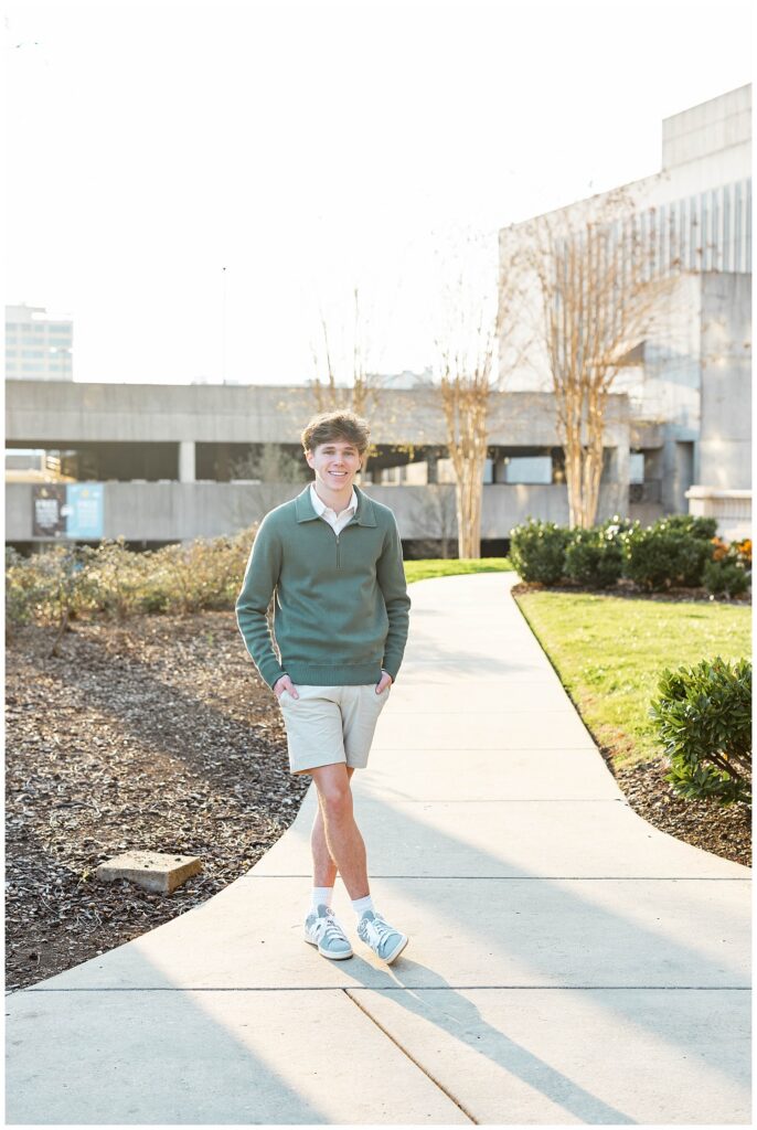 senior session at the sidewalk next to the Chattanooga courthouse downtown during golden hour