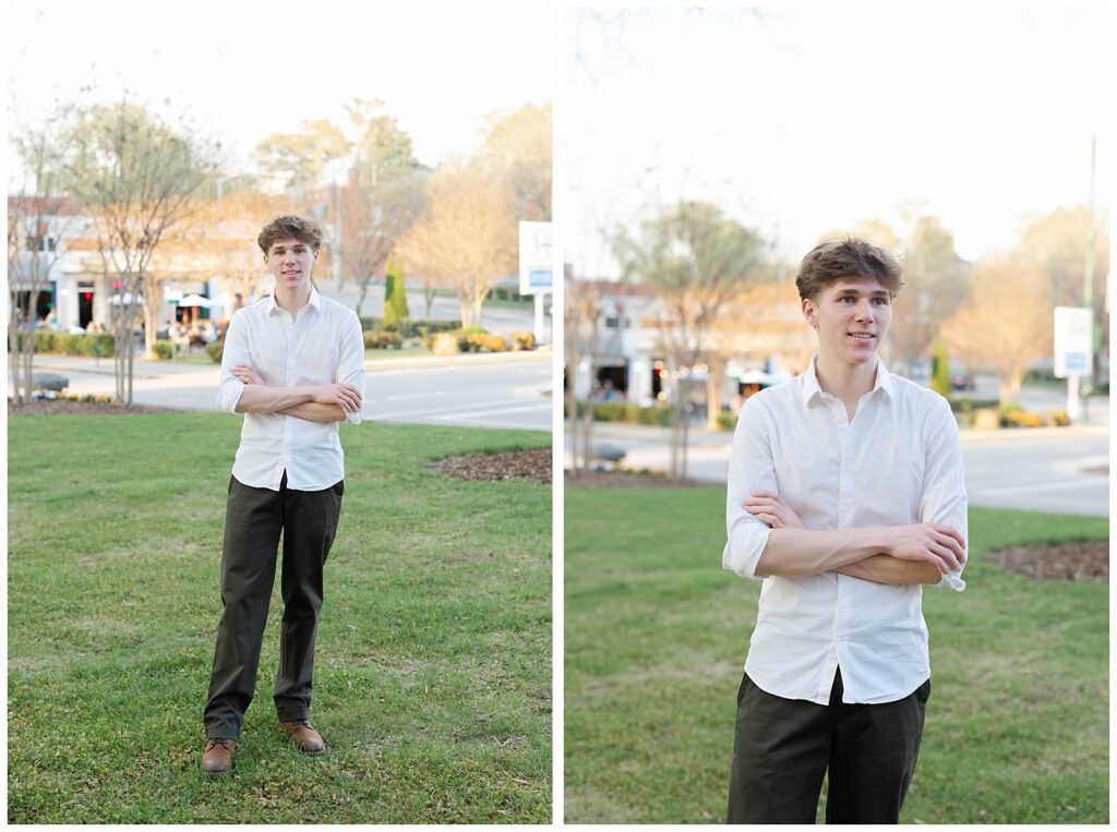 high school senior wearing a white shirt and black pants posing in front of the courthouse