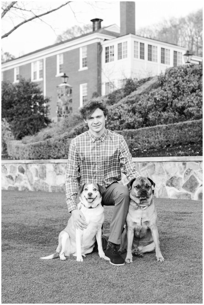 Chattanooga high school senior posing with his dogs at McCallie School
