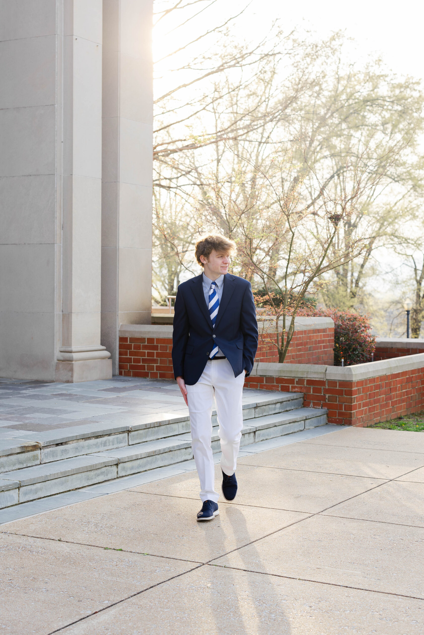 senior walking with his hands in pockets at McCallie School